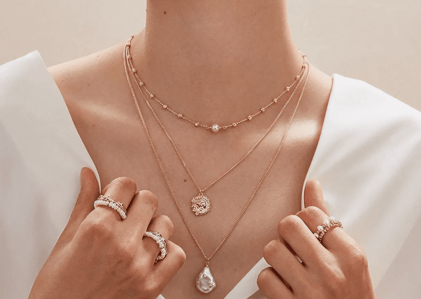 Elegant lifestyle shot of high-end necklaces and rings — Bhargo Jewellery